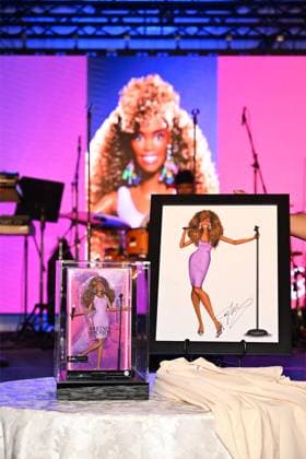 Whitney Houston Barbie doll unveiled by her sister-in-law and former manager Pat Houston at the Fifth Legacy of Love Gala in Atlanta on August 8 The first-ever Whitney Houston Barbie doll was unveiled by her sister-in-law and former manager Pat Houston, who revealed it was 20 years in the making., , Pat, who is also executor of the late singer’s estate, unveiled the doll at the Fifth Legacy of Love Gala, an annual event hosted by the Whitney E. Houston Legacy Foundation, in Atlanta on Friday (AUGUST 8)., , The Barbie Signature Whitney Houston Doll recreates Whitney’s look in the 1987 music video for her huge hit I Wanna Dance with Somebody (Who Loves Me) ., , Pat worked closely with the Barbie design team to help shape the doll’s look, for  Copyright: xThexMegaxAgencyxDerekxWhitexforxMattelxInc Megax