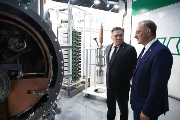 Russia Putin Siberian Federal District 9220425 11.08.2026 Rosatom State Atomic Energy Corporation Director General Alexey Likhachev and Head of the Budker Institute of Nuclear Physics Pavel Logachev wait before the arrival of Russian President Vladimir Putin to the Siberian Ring Photon Source (SKIF) synchrotron radiation facility near the Koltsovo science town in Novosibirsk region, Russia. Sergey Fadeichev Sputnik Novosibirsk Region Russia  Copyright: xSergeyxFadeichevx