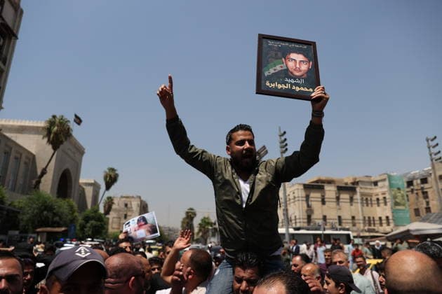 Death sentences for Bashar al-Assad and senior figures in Syria welcomed with celebrations DAMASCUS, SYRIA - AUGUST 11: Syrians gather around the Palace of Justice to celebrate a court s death sentences against ousted leader Bashar al-Assad, his brother Maher al-Assad and his cousin Atef Najib, carrying photographs of people killed by the Assad regime, in the capital Damascus, Syria, on August 11, 2026. Izz Aldien Alqasem Anadolu Damascus Syria. Editorial use only. Please get in touch for any other usage.  Copyright: x2026xAnadoluxIzzxAldienxAlqasemx