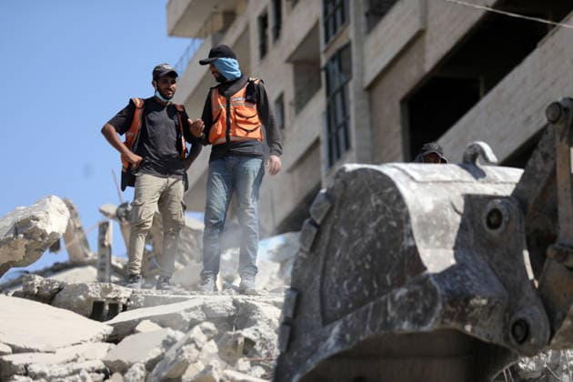 Civil Defense Teams Recover Bodies From Gaza City Rubble Palestinian Civil Defense members, in cooperation with the International Committee of the Red Cross (ICRC), work with limited resources to recover bodies from beneath the rubble of a home belonging to the Gharbiya family in western Gaza City, Gaza Strip, on August 11, 2026. Medics say 13 bodies remain trapped under the rubble, as search and recovery operations continue amid a severe shortage of heavy equipment needed to clear debris and reach the victims. Photo by Bilal Osama apaimages Gaza city Gaza Strip Palestinian Territory 110826_Gaza_BO_01(15) Copyright: xapaimagesxBilalxOsamax xapaimagesx