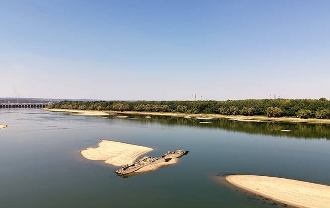 World War II-German warships emerge from Danube amid low water levels in Serbia PRAHOVO, SERBIA - AUGUST 11: Sunken hulls of World War II-era Nazi warships lie exposed in the Danube River near Prahovo, Serbia on August 11, 2026. Extreme heat and severe drought across Europe have caused water levels in the river to drop to historic lows, revealing dozens of scuttled German vessels laden with explosives from 1944. According to some estimates, around 200 World War II shipwrecks lie on the sandy bed of the Danube. Sasa Djordjevic Anadolu Prahovo Serbia. Editorial use only. Please get in touch for any other usage.  Copyright: x2026xAnadoluxSasaxDjordjevicx