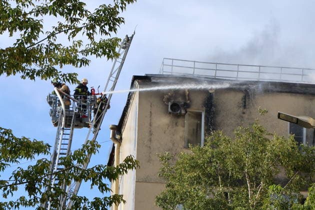 RUSSIA, ST PETERSBURG - AUGUST 11, 2026: Emergency workers climb an aerial ladder to battle a roof fire at the Vyborgsky Palace of Culture. Valentin Yegorshin TASS  96035631
