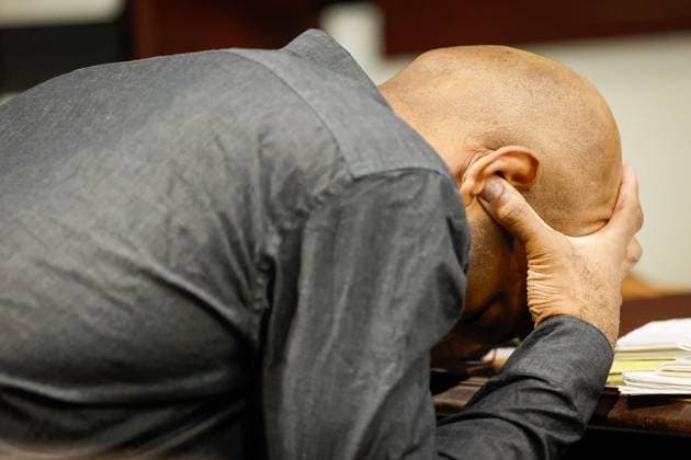 August 11, 2026, Tampa, Florida, USA: Defendant Joseph Killins uses his thumbs to cover his ears, while Assistant State Attorney Jessica Couvertier gives an opening statement to jurors during his trial inside courtroom 51a of the Hillsborough Courthouse Annex on Tuesday, Aug. 11, 2026, in Tampa. Tampa USA  - ZUMAs70_ 20260811_zan_s70_006 Copyright: xJeffereexWoox
