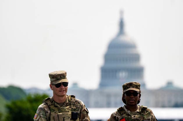 Members of the National Guard patrol near the Washington Monument in Washington, DC on Tuesday, August 11, 2026. Today marks the one year anniversary the National Guard troops, more than 4,600 at present, have patrolled the streets of Washington, DC, after President Donald Trump deployed them in August 2025.  WAP2026081126360 BONNIExCASH
