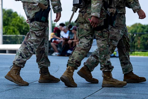 Members of the National Guard patrol near the Washington Monument in Washington, DC on Tuesday, August 11, 2026. Today marks the one year anniversary the National Guard troops, more than 4,600 at present, have patrolled the streets of Washington, DC, after President Donald Trump deployed them in August 2025.  WAP2026081126364 BONNIExCASH