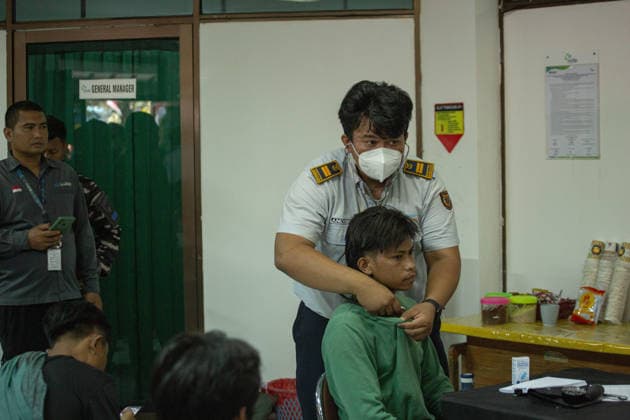 August 12, 2026, Karangasem, Bali, Indonesia: Passengers of the ferry KMP Putri Yasmin await data collection and medical examinations at the ASDP Emergency Post in Padangbai Port, Karangasem, Bali. ...A navy vessel and surrounding ships rushed to rescue 131 people onboard (114 passengers and 17 crew members) after the inter-island ferry caught fire in the Sekotong waters of the Lombok Strait at around 4:15 AM local time during its voyage to Lembar, Lombok. Authorities confirmed 35 survivors were evacuated back to Padangbai, while the remaining were transported to Lombok. One casualty was reported in the incident. Karangasem Indonesia - ZUMAp229 20260812_zip_p229_005 Copyright: xLanaxPriatnax