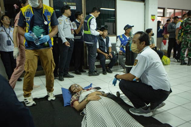 August 12, 2026, Karangasem, Bali, Indonesia: Passengers of the ferry KMP Putri Yasmin await data collection and medical examinations at the ASDP Emergency Post in Padangbai Port, Karangasem, Bali. ...A navy vessel and surrounding ships rushed to rescue 131 people onboard (114 passengers and 17 crew members) after the inter-island ferry caught fire in the Sekotong waters of the Lombok Strait at around 4:15 AM local time during its voyage to Lembar, Lombok. Authorities confirmed 35 survivors were evacuated back to Padangbai, while the remaining were transported to Lombok. One casualty was reported in the incident. Karangasem Indonesia - ZUMAp229 20260812_zip_p229_008 Copyright: xLanaxPriatnax