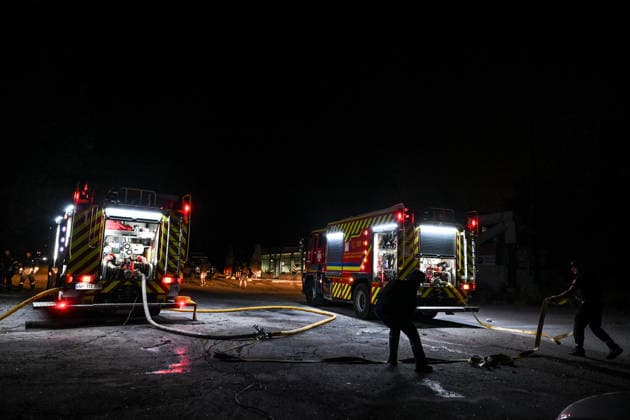 RECORD DATE NOT STATED State Emergency Service of Ukraine rescuers deploy fire hoses from a fire engine during response efforts following an overnight Russian strike on Zaporizhzhia, Ukraine, on August 11, 2026. Overnight on August 11, Russian forces launched a massive combined strike on Zaporizhzhia, firing 10 missiles at the city, including a North Korean ballistic missile and Zircon hypersonic missiles, as well as guided aerial bombs (KABs). The attack completely destroyed the State Center for Standardization, Metrology and Certification and damaged or destroyed a number of industrial facilities and civilian infrastructure sites, including food establishments, four apartment buildings and a garage cooperative, where the blast wave demolished garages and dozens  Copyright: xDmytroxSmolienkox