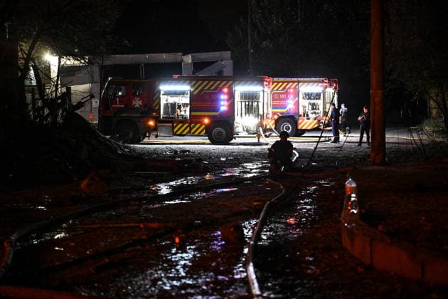 RECORD DATE NOT STATED State Emergency Service of Ukraine rescuers deploy fire hoses from a fire engine during response efforts following an overnight Russian attack on Zaporizhzhia, Ukraine, on August 11, 2026. Overnight on August 11, Russian forces launched a massive combined strike on Zaporizhzhia, firing 10 missiles at the city, including a North Korean ballistic missile and Zircon hypersonic missiles, as well as guided aerial bombs (KABs). The attack completely destroyed the State Center for Standardization, Metrology and Certification and damaged or destroyed a number of industrial facilities and civilian infrastructure sites, including food establishments, four apartment buildings and a garage cooperative, where the blast wave demolished garages and dozens  Copyright: xDmytroxSmolienkox