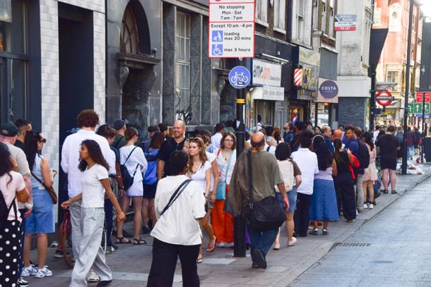 August 12, 2026, London, England, United Kingdom: A long queue forms outside the AM2PM convenience store on Whitechapel High Street in London as people try to snag last-minute solar eclipse glasses ahead of the partial eclipse this evening. London United Kingdom - ZUMAv130 20260812_zip_v130_009 Copyright: xVukxValcicx