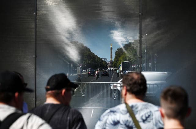 65th Anniversary of the Berlin Wall in Berlin BERLIN, GERMANY – AUGUST 12: People visit the opening ceremony of a 30-meter-long temporary memorial installation and the open-air exhibition Views of the Wall: Berlin 1961–1990, marking the 65th anniversary of the construction of the Berlin Wall, near the Brandenburg Gate in Berlin, Germany, on August 12, 2026. Volodymyr Sindieiev Anadolu Berlin Germany. Editorial use only. Please get in touch for any other usage.  Copyright: x2026xAnadoluxVolodymyrxSindieievx