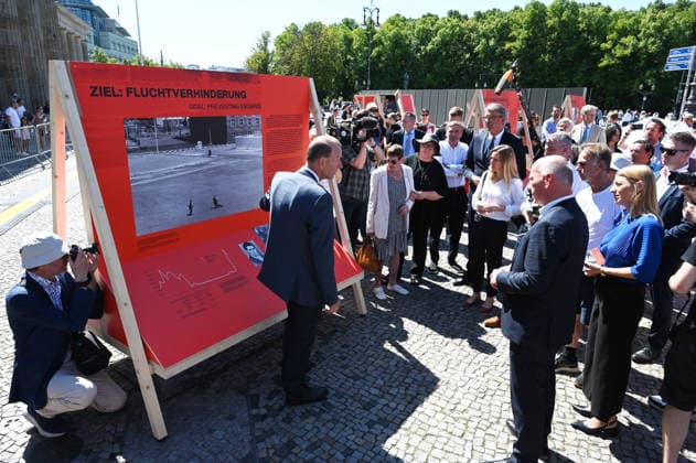 65th Anniversary of the Berlin Wall in Berlin BERLIN, GERMANY – AUGUST 12: Berlin’s Governing Mayor Kai Wegner and Federal Commissioner for Culture and the Media Wolfram Weimer attend the opening ceremony of a 30-meter-long temporary memorial installation and the open-air exhibition Views of the Wall: Berlin 1961–1990, marking the 65th anniversary of the construction of the Berlin Wall, near the Brandenburg Gate in Berlin, Germany, on August 12, 2026. Volodymyr Sindieiev Anadolu Berlin Germany. Editorial use only. Please get in touch for any other usage.  Copyright: x2026xAnadoluxVolodymyrxSindieievx