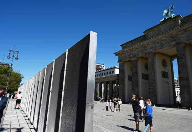 65th Anniversary of the Berlin Wall in Berlin BERLIN, GERMANY – AUGUST 12: People visit the opening ceremony of a 30-meter-long temporary memorial installation and the open-air exhibition Views of the Wall: Berlin 1961–1990, marking the 65th anniversary of the construction of the Berlin Wall, near the Brandenburg Gate in Berlin, Germany, on August 12, 2026. Volodymyr Sindieiev Anadolu Berlin Germany. Editorial use only. Please get in touch for any other usage.  Copyright: x2026xAnadoluxVolodymyrxSindieievx