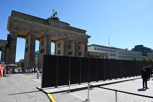 65th Anniversary of the Berlin Wall in Berlin BERLIN, GERMANY – AUGUST 12: People visit the opening ceremony of a 30-meter-long temporary memorial installation and the open-air exhibition Views of the Wall: Berlin 1961–1990, marking the 65th anniversary of the construction of the Berlin Wall, near the Brandenburg Gate in Berlin, Germany, on August 12, 2026. Volodymyr Sindieiev Anadolu Berlin Germany. Editorial use only. Please get in touch for any other usage.  Copyright: x2026xAnadoluxVolodymyrxSindieievx