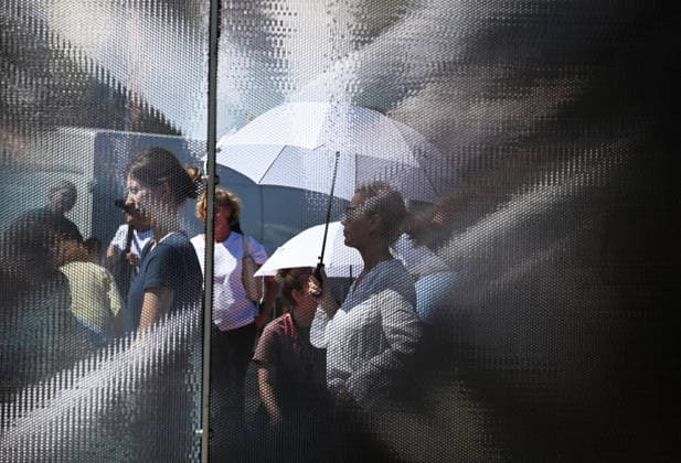 65th Anniversary of the Berlin Wall in Berlin BERLIN, GERMANY – AUGUST 12: People visit the opening ceremony of a 30-meter-long temporary memorial installation and the open-air exhibition Views of the Wall: Berlin 1961–1990, marking the 65th anniversary of the construction of the Berlin Wall, near the Brandenburg Gate in Berlin, Germany, on August 12, 2026. Volodymyr Sindieiev Anadolu Berlin Germany. Editorial use only. Please get in touch for any other usage.  Copyright: x2026xAnadoluxVolodymyrxSindieievx