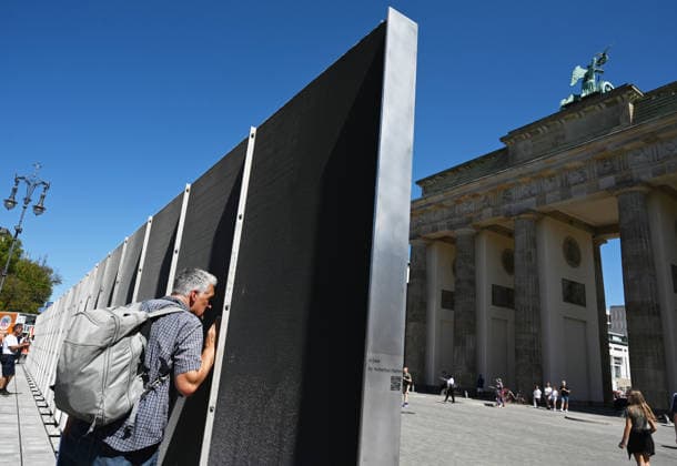 65th Anniversary of the Berlin Wall in Berlin BERLIN, GERMANY – AUGUST 12: People visit the opening ceremony of a 30-meter-long temporary memorial installation and the open-air exhibition Views of the Wall: Berlin 1961–1990, marking the 65th anniversary of the construction of the Berlin Wall, near the Brandenburg Gate in Berlin, Germany, on August 12, 2026. Volodymyr Sindieiev Anadolu Berlin Germany. Editorial use only. Please get in touch for any other usage.  Copyright: x2026xAnadoluxVolodymyrxSindieievx