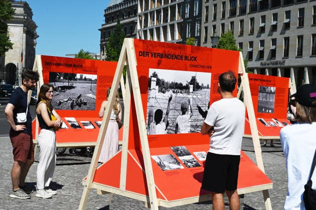 65th Anniversary of the Berlin Wall in Berlin BERLIN, GERMANY – AUGUST 12: People visit the opening ceremony of a 30-meter-long temporary memorial installation and the open-air exhibition Views of the Wall: Berlin 1961–1990, marking the 65th anniversary of the construction of the Berlin Wall, near the Brandenburg Gate in Berlin, Germany, on August 12, 2026. Volodymyr Sindieiev Anadolu Berlin Germany. Editorial use only. Please get in touch for any other usage.  Copyright: x2026xAnadoluxVolodymyrxSindieievx