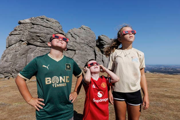 Solar eclipse, Haytor Dartmoor, Devon, UK - 12 Aug 2026 NEWS - Youngsters, Joey, Alfie and Bella can™t wait for the solar eclipse at Haytor Rock ahead of the solar eclipse from Haytor, Dartmoor, Devon where people will come to view the eclipse on 12th August 2026. Haytor Dartmoor Devon GBR Copyright: xPhilxMingo PPAUKx PPA-297098