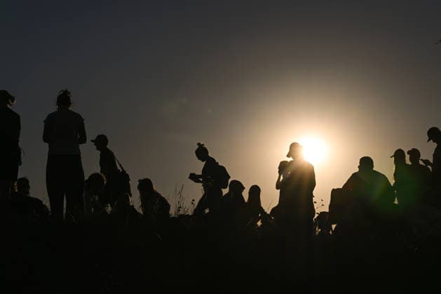 Hundreds Gather At Krakow s Historic Krakus Mound To Watch Solar Eclipse KRAKOW, POLAND - AUGUST 12: People gather on top of the Krakus Mound (Kopiec Krakusa) to watch a solar eclipse on August 12, 2026 in Krakow, Poland. Hundreds of residents and tourists ascended the historic prehistoric mound, which offers panoramic views of the city, equipped with protective eyewear and telescopes to witness the rare celestial event. Krakow Poland  Copyright: xArturxWidakx originalFilename: widak-hundreds260812_np8fJ.jpg