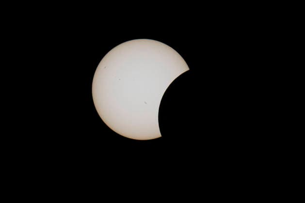This image shows a partial solar eclipse captured in Hemiksem on %datetext. The moon will cover about 90% of the sun during this solar eclipse. %PHOTOGRAPHER  TomxGoyvaerts 183229138