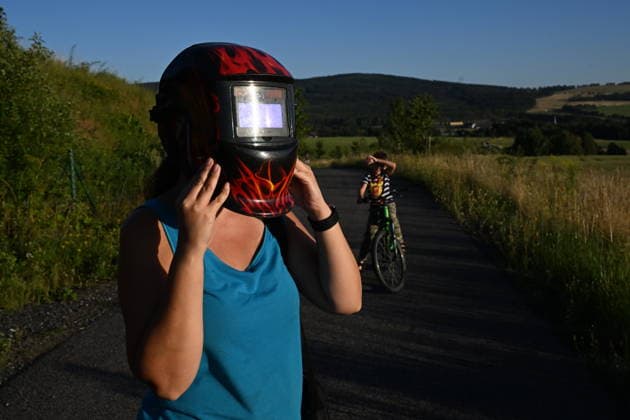 People observe partial solar eclipse in Detrichov, Czech Republic, August 12, 2026. (CTKxPhoto ) CTKPhotoP2026081206368  CTKPhotoP2026081206368
