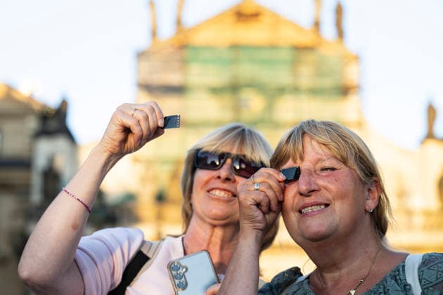 People observe partial solar eclipse in Prague, Czech Republic, August 12, 2026. (CTKxPhoto MichalxKamaryt) CTKPhotoP2026081206732  CTKPhotoP2026081206732