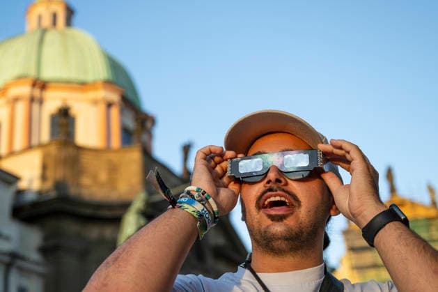 People observe partial solar eclipse in Prague, Czech Republic, August 12, 2026. (CTKxPhoto MichalxKamaryt) CTKPhotoP2026081206752  CTKPhotoP2026081206752