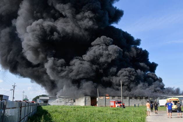 RUSSIA, KRASNODAR REGION - AUGUST 12, 2026: Smoke billows over a warehouse storing plastic products, hit by fire in the village of Lenina, southeast of Krasnodar. The fire covering an area of 2.2 thousand sq m has been contained. Roman Sokolov TASS  96069790