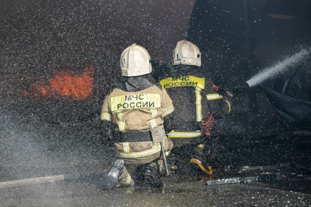 RUSSIA, KRASNODAR REGION - AUGUST 12, 2026: Employees of the Russian Emergencies Minsitry respond to a fire at a warehouse storing plastic products in the village of Lenina, southeast of Krasnodar. The fire covering an area of 2.2 thousand sq m has been contained Russia  - ZUMAt113 20260812_zaa_t113_347 Copyright: xRomanxSokolovx