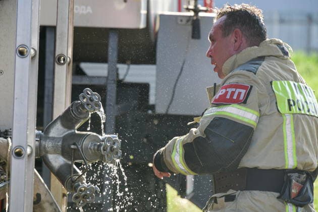 RUSSIA, KRASNODAR REGION - AUGUST 12, 2026: An employee of the Russian Emergencies Minsitry responds to a fire at a warehouse storing plastic products in the village of Lenina, southeast of Krasnodar. The fire covering an area of 2.2 thousand sq m has been contained. Roman Sokolov TASS  96070255