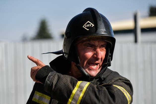 RUSSIA, KRASNODAR REGION - AUGUST 12, 2026: An employee of the Russian Emergencies Minsitry responds to a fire at a warehouse storing plastic products in the village of Lenina, southeast of Krasnodar. The fire covering an area of 2.2 thousand sq m has been contained Russia  - ZUMAt113 20260812_zaa_t113_376 Copyright: xRomanxSokolovx