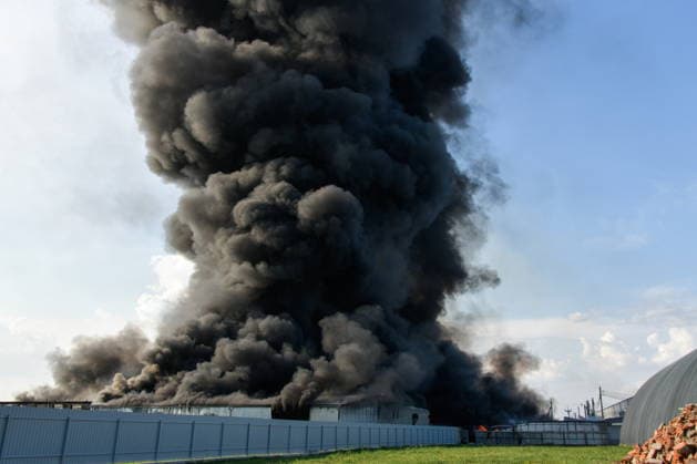 RUSSIA, KRASNODAR REGION - AUGUST 12, 2026: Smoke billows over a warehouse storing plastic products, hit by fire in the village of Lenina, southeast of Krasnodar. The fire covering an area of 2.2 thousand sq m has been contained Russia  - ZUMAt113 20260812_zaa_t113_381 Copyright: xRomanxSokolovx