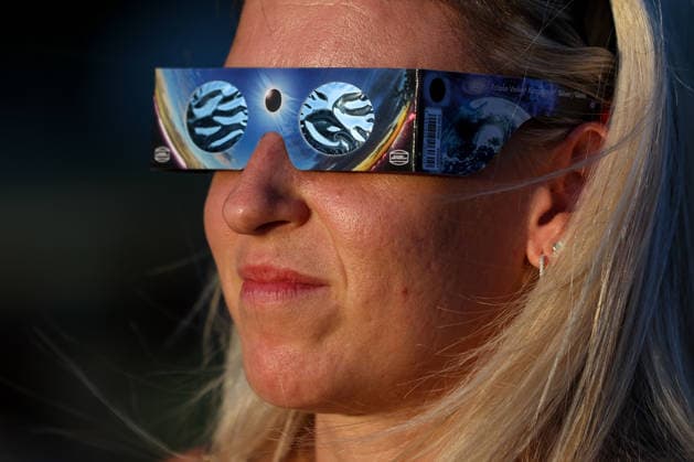Solar eclipse in Croatia Woman watch the moon partially covers the sun during a solar eclipse in Zagreb, Croatia, August 12, 2026  IgorxKralj PIXSELL