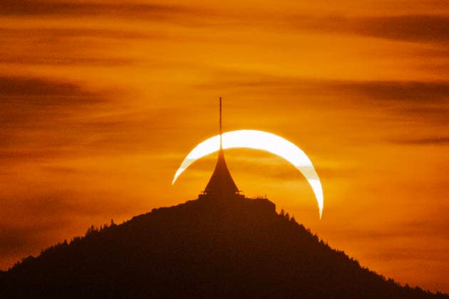 Partial solar eclipse with Jested tower silhouette in Dalesice, Czech Republic, August 12, 2026. (CTKxPhoto RadekxPetrasek) CTKPhotoP2026081207637  CTKPhotoP2026081207637