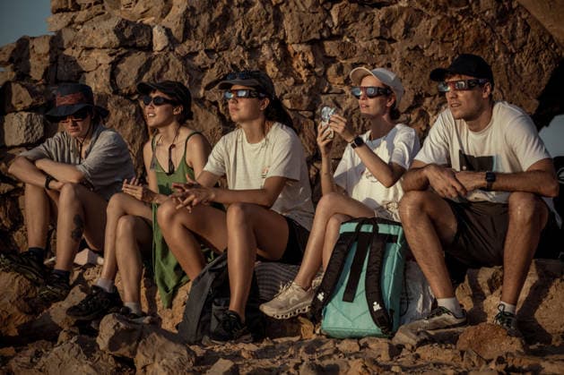 August 12, 2026, Ciutadella, Balearic Islands Menorca, Spain: People wearing protective glasses watch a total solar eclipse at Punta Nati on the Spanish Balearic island of Menorca. Ciutadella Spain - ZUMAo105 20260812_fap_o105_010 Copyright: xMatthiasxOesterlex