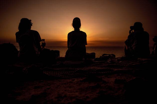 August 12, 2026, Ciutadella, Balearic Islands Menorca, Spain: People are silhouetted against the evening sky as they watch a total solar eclipse at Punta Nati on the Spanish Balearic island of Menorca Ciutadella Spain - ZUMAo105 20260812_fap_o105_022 Copyright: xMatthiasxOesterlex