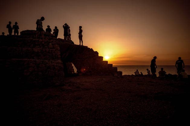 August 12, 2026, Ciutadella, Balearic Islands Menorca, Spain: People are silhouetted against the evening sky as they watch a total solar eclipse at Punta Nati on the Spanish Balearic island of Menorca Ciutadella Spain - ZUMAo105 20260812_fap_o105_027 Copyright: xMatthiasxOesterlex