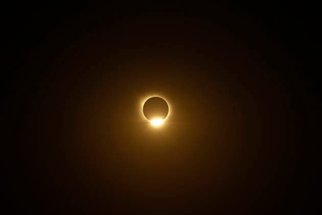 August 12, 2026, Madrid, Madrid, Spain: The distinct and breathtaking phases of a rare total solar eclipse unfold across the celestial sphere above Madrid, captured from the elevated open grounds of the Parque Forestal de Valdebebas - Felipe VI on Wednesday, August 12, 2026. Marking the first total solar eclipse visible from the Spanish mainland in 114 years, this monumental astronomical milestone traces the dramatic progression from the initial partial contact through the intermediate stages, culminating in the sublime beauty of totality. The sequence captures the razor-thin crescent of sunlight, the gradual occlusion of the solar disk by the Moon, and the ethereal, pearly-white wisps of the solar corona stretching into the darkening eveni - ZUMAo127 20260812_zep_o127_038 Copyright: xHugoxOrtunox