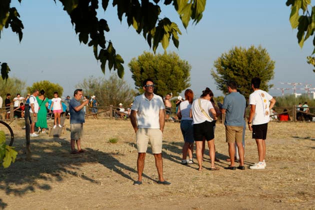 August 12, 2026, Madrid, Community Of Madrid, Spain: A massive crowd of astronomy enthusiasts and families gathers in the elevated grounds of the Parque Forestal de Valdebebas Felipe VI in Madrid, united by the anticipation of the first total solar eclipse visible from the Spanish mainland in 114 years. As the historic celestial event reaches its peak, the atmosphere in the park remains focused and disciplined; attendees are seen equipped with government-distributed, ISO 12312-2 certified solar glasses to safely observe the Sun s occlusion by the Moon. The choice of this expansive public park, with its unobstructed horizon and minimal urban light pollution, offers thousands of spectators a prime vantage point to witness the transition of da - ZUMAo127 20260812_zep_o127_071 Copyright: xHugoxOrtunox