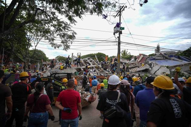 (260812) -- CALI, Aug. 12, 2026 -- Rescuers conduct search and rescue operations on the ruins of a building damaged in an earthquake in Cali, Colombia, Aug. 12, 2026. The death toll from Monday s 7.4-magnitude earthquake in western Colombia has risen to 241, with 3,771 others injured, Colombian media reported Wednesday, citing figures from the National Unit for Disaster Risk Management. (Photo by Xinhua) COLOMBIA-CALI-EARTHQUAKE-SEARCH AND RESCUE AndresxMoreno 
