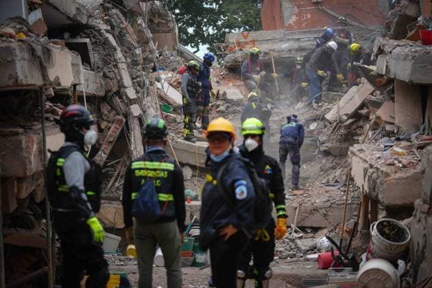 (260812) -- CALI, Aug. 12, 2026 -- Rescuers conduct search and rescue operations on the ruins of a building damaged in an earthquake in Cali, Colombia, Aug. 12, 2026. The death toll from Monday s 7.4-magnitude earthquake in western Colombia has risen to 241, with 3,771 others injured, Colombian media reported Wednesday, citing figures from the National Unit for Disaster Risk Management. (Photo by Xinhua) COLOMBIA-CALI-EARTHQUAKE-SEARCH AND RESCUE AndresxMoreno 