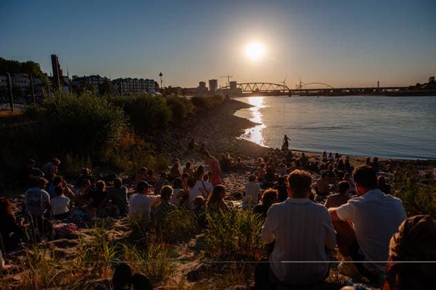 August 12, 2026, Nijmegen, Netherlands: Hundreds of people are enjoying the partial solar eclipse next to the river. On the banks of the Waal River in Nijmegen, people gathered to watch the partial solar eclipse. The solar eclipse began at 7:16 PM, with 88% of the sun eclipsed by 8:11 PM. This is the largest partial solar eclipse the Netherlands has seen since 1999; the next one of this magnitude will be in 2081. Nijmegen Netherlands - ZUMAs197 20260812_aaa_s197_186 Copyright: xAnaxFernandezx