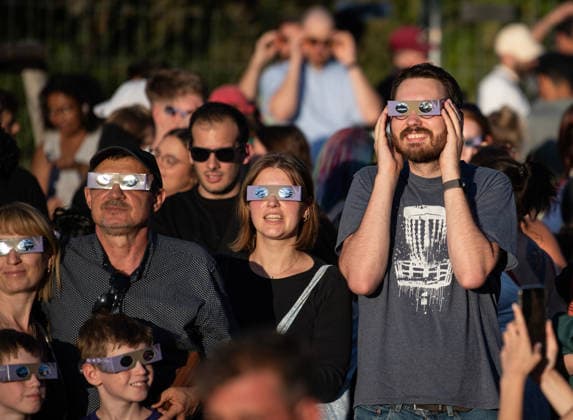 (260812) -- BERLIN, Aug. 12, 2026 -- People observe the partial solar eclipse at the Zeiss Grand Planetarium in Berlin, Germany, Aug. 12, 2026. The Long Night of Astronomy event was held here on Wednesday, inviting the public to observe the solar eclipse and experience the fascination of astronomy. ) GERMANY-BERLIN-SOLAR ECLIPSE ZhangxHaofu 
