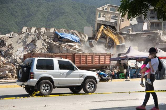 Recovery Efforts Continue in Earthquake-Ravaged La Guaira LA GUAIRA, VENEZUELA AUGUST 12, 2026: Residents continue moving through earthquake-damaged neighborhoods in Tanaguarena, Los Corales and Catia La Mar, where destroyed roads, collapsed buildings and debris continue to disrupt daily life 49 days after the twin earthquakes struck Venezuela s central coast. With public transportation limited, residents walk through rubble and around heavy machinery to reach different parts of the affected areas, while many continue searching for drinking water as recovery and debris removal operations remain underway. Estado la guaira Venezuela (Bolivarian Republic of) Copyright: x xFranyerxNievesx(Babel)x xJNAxPressx