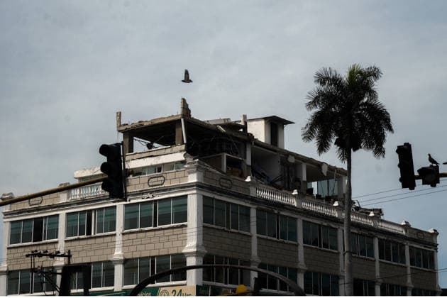 August 12, 2026, Cali, Valle Del Cauca, Colombia: People gather outside collapsed buildings in Cali, Colombia on August 12, 2026 to aid in several rescue labors after a 7,4 magnitude earthquake that struck the cities of Quibdo, Cali, Pereira and Manizales leaving more than 200 casualties past august 10. Cali Colombia - ZUMAvp1_ 20260812_zia_vp1_040 Copyright: xMartinxStevenxAngelx