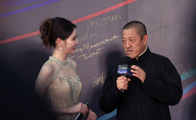 HARBIN, CHINA - AUGUST 12: Director Ding Sheng is interviewed on the red carpet for the closing ceremony of the Seventh Jackie Chan International Action Film Week at Harbin Ice and Snow World on August 12, 2026 in Harbin, Heilongjiang Province of China. The event featured hundreds of filmmakers attending the red carpet ceremony.  Copyright: xVCGx 111659586587