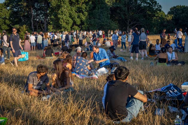 Solar Eclipse Over Hampstead Heath London, 2026 Visitors gathered at Hampstead Heath in North London to watch the solar eclipse. The eclipse was visible across the London skyline, with spectators looking towards the sky and capturing the event on cameras and phones., Credit:Zak Irfan Avalon  Copyright: xZakxIrfanx xAvalonx 1122597066