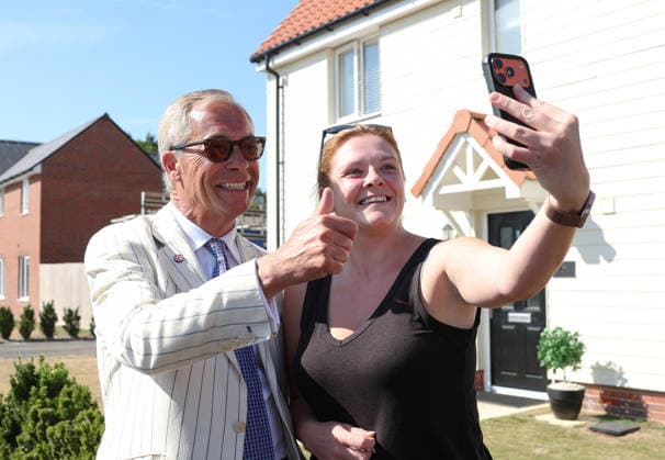 August 13, 2026, Clacton-On-Sea, Essex, UK: Clacton-On-Sea, UK. Reform UK leader, Nigel Farage, takes a selfie with a local resident, at a polling station in Clacton-On-Sea, Essex. Nigel Farage has resigned his seat and has been campaigning to be re-elected in the Clacton constituency at the by-election, which takes place today. Clacton-On-Sea UK  - ZUMAl94_ 20260813_zaf_l94_030 Copyright: xJacquelinexLawriex