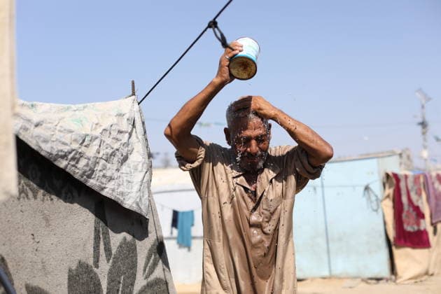 Displaced Palestinian Families Endure Summer Heat in Nuseirat Displaced Palestinian families live in tents in Nuseirat refugee camp in the central Gaza Strip, on August 13, 2026, as they struggle to cope with high temperatures and summer heat amid difficult living conditions. Photo by Hassan al-Jedi apaimages Nusairat Gaza Strip Palestinian Territory 130826_Nuseirat_HJ_00(51).jpeg Copyright: xapaimagesxHassanxal-Jedixx xapaimagesx