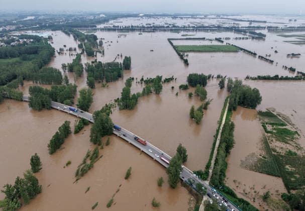 (260813) -- LUOHE, Aug. 13, 2026 -- An aerial drone photo taken on Aug. 13, 2026 shows the Nihewa flood storage and detention area in Wuyang County of Luohe City, central China s Henan Province. Affected by Typhoon Dolphin, the 13th typhoon of the year, the Shaying River has recorded a flow rate exceeding 3,000 cubic meters per second in its Luohe section, while the water level continues to rise. In accordance with relevant contingency plans, Henan Province activated the Nihewa flood storage and detention area on Thursday. ) CHINA-HENAN-LUOHE-TYPHOON DOLPHIN-FLOOD STORAGE AREA (CN) HaoxYuan 
